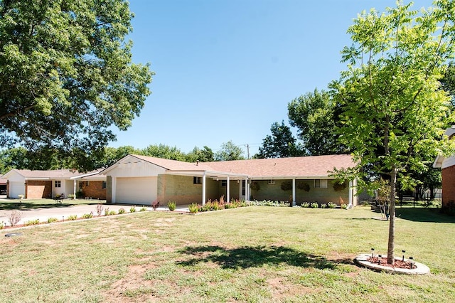 single story home featuring a garage and a front lawn