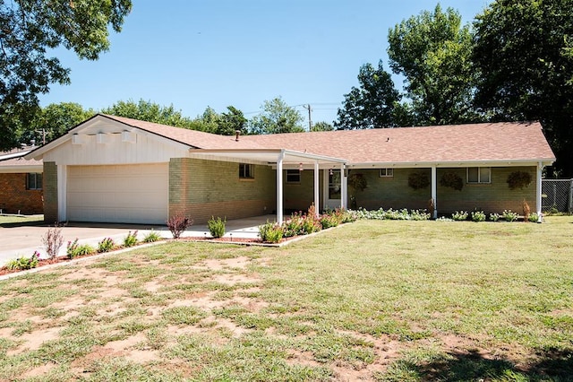 single story home featuring a garage and a front yard