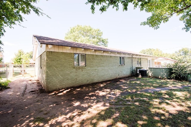 back of property with central AC