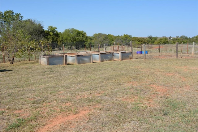 view of yard with a rural view