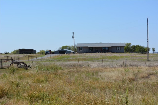 view of yard with a rural view