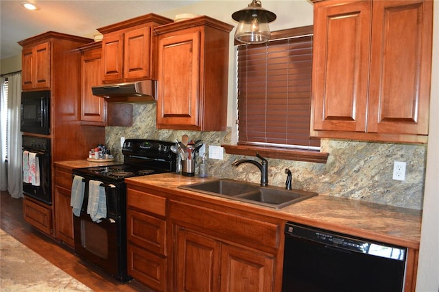 kitchen featuring dark hardwood / wood-style flooring, sink, tasteful backsplash, and black appliances