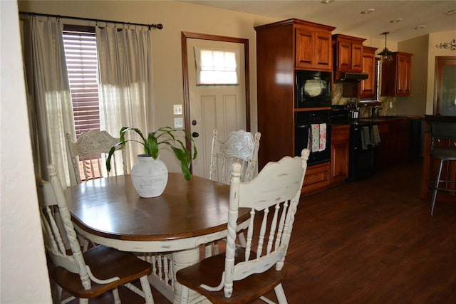 dining room with dark wood-type flooring