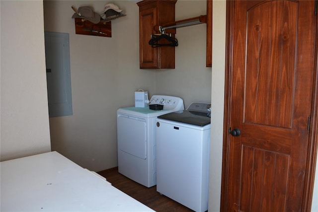 washroom featuring cabinets, dark hardwood / wood-style flooring, separate washer and dryer, and electric panel