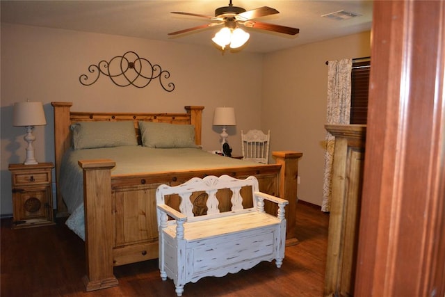 bedroom with ceiling fan and dark hardwood / wood-style flooring