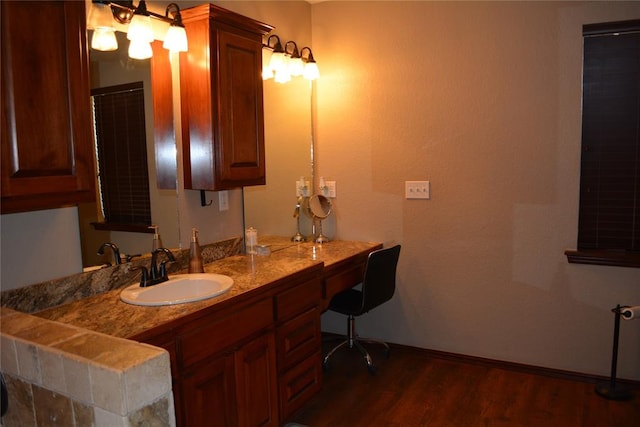 bathroom featuring hardwood / wood-style floors and vanity