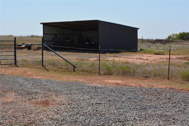 view of outbuilding featuring a rural view