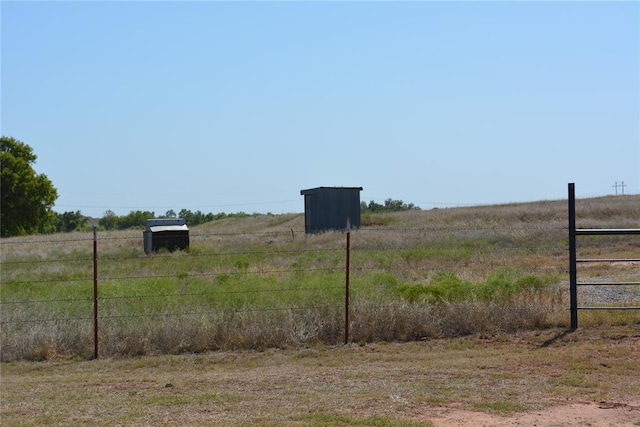 view of yard with a rural view