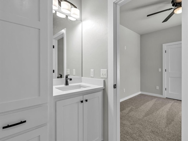 bathroom with ceiling fan and vanity