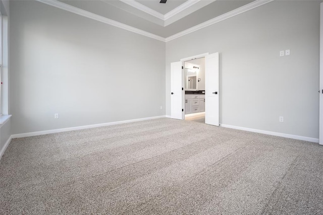 carpeted spare room featuring ornamental molding