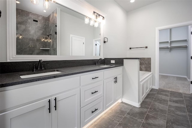 bathroom with tile patterned floors, vanity, and shower with separate bathtub