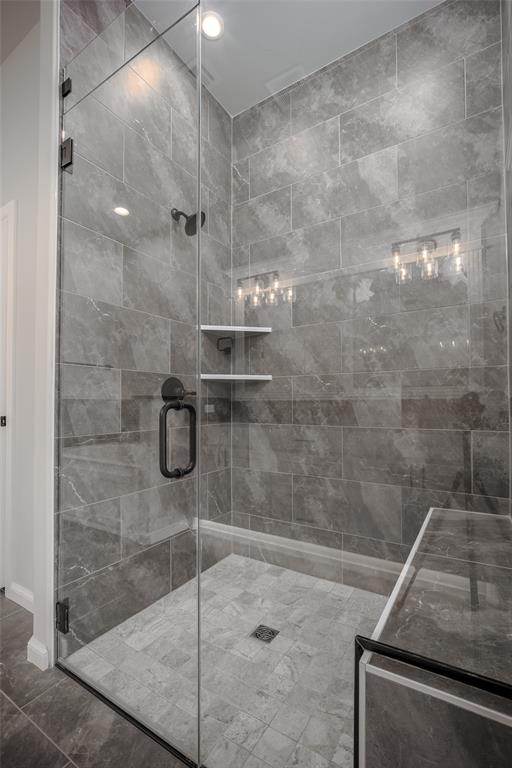 bathroom featuring an enclosed shower