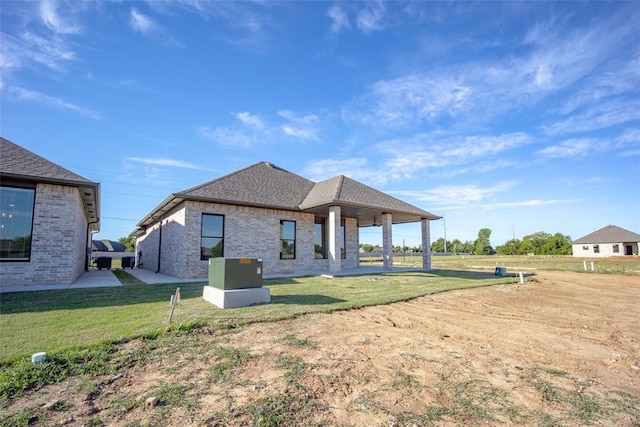 rear view of house with a lawn