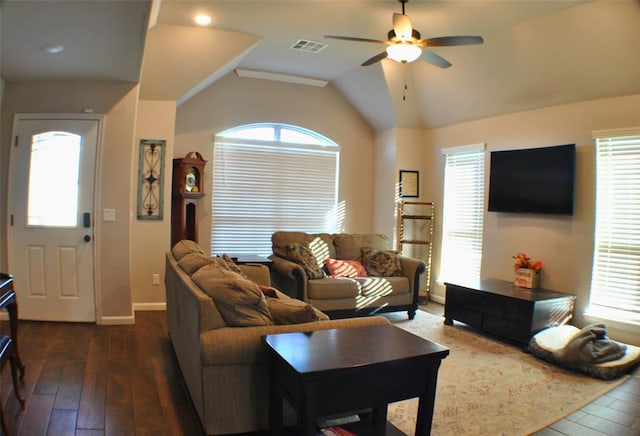 living room featuring ceiling fan, dark wood-type flooring, and vaulted ceiling