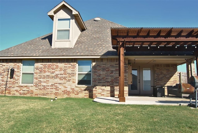 back of house with a pergola, a yard, a patio, and french doors