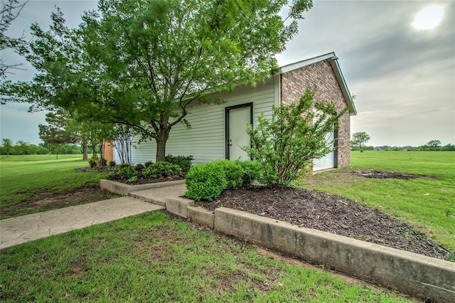 view of property exterior with a yard
