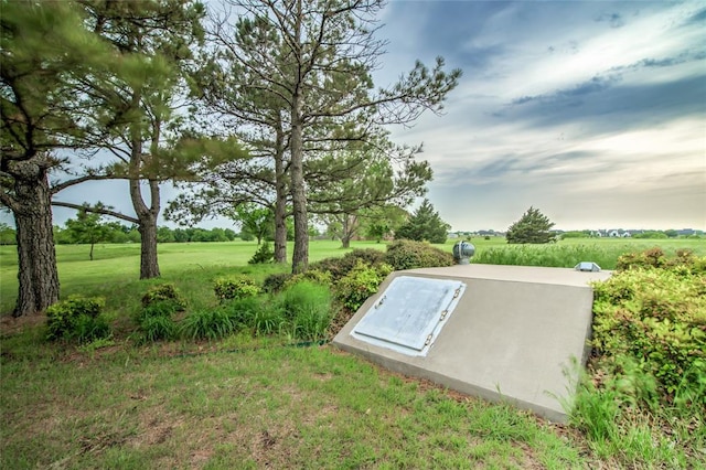 view of storm shelter featuring a lawn