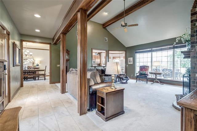 living room with baseboards, high vaulted ceiling, beam ceiling, and ceiling fan with notable chandelier