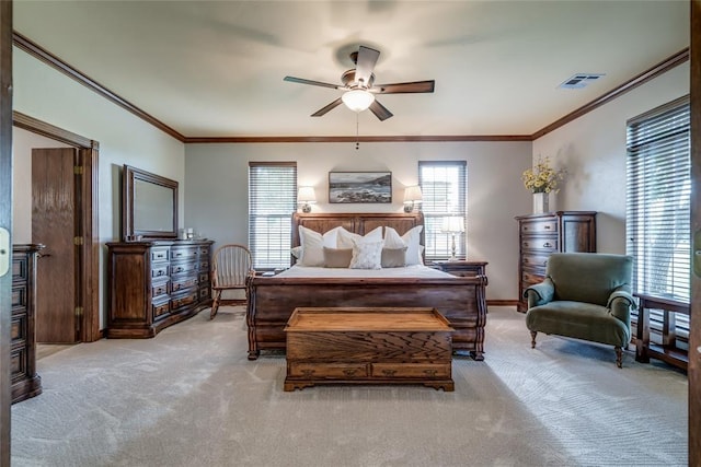 bedroom featuring crown molding, light colored carpet, a ceiling fan, and visible vents