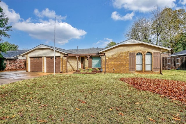 ranch-style home with a front yard and a garage