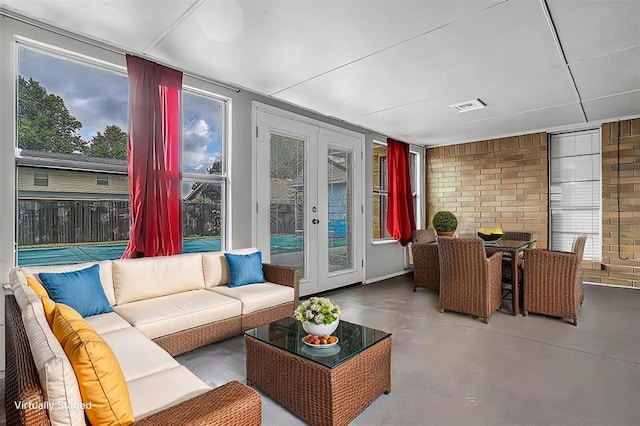 sunroom / solarium featuring french doors and visible vents