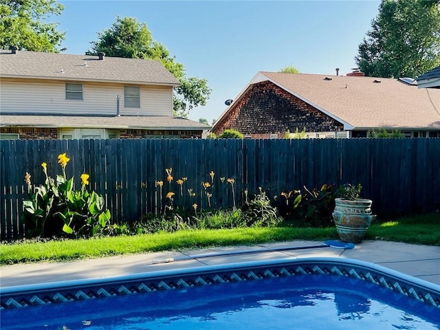 view of pool with a fenced backyard and a fenced in pool