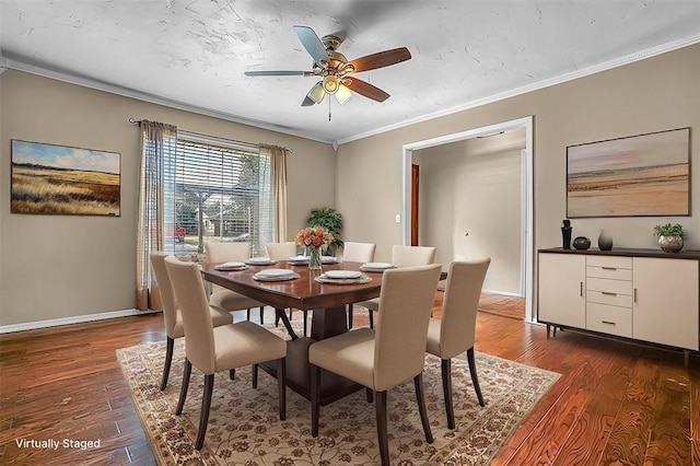 dining room featuring a ceiling fan, baseboards, dark wood-type flooring, and crown molding