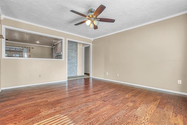 unfurnished room with crown molding, a textured ceiling, ceiling fan, and wood finished floors