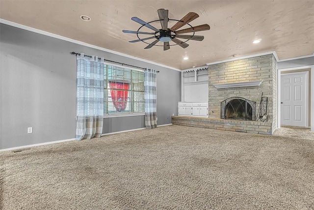 unfurnished living room featuring ornamental molding, carpet flooring, a fireplace, and baseboards