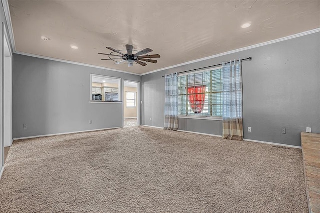 carpeted empty room with baseboards, ornamental molding, ceiling fan, and recessed lighting