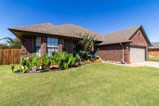 ranch-style home with a garage and a front lawn