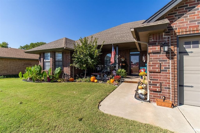 entrance to property featuring a yard