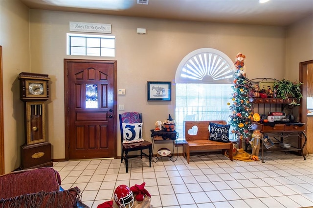 entrance foyer featuring light tile patterned floors