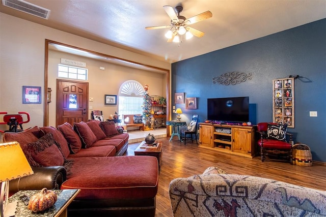 living room with ceiling fan and wood-type flooring