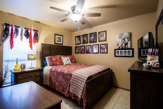 bedroom with ceiling fan and light tile patterned flooring