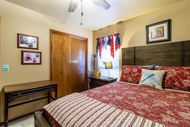 bedroom featuring ceiling fan and a closet