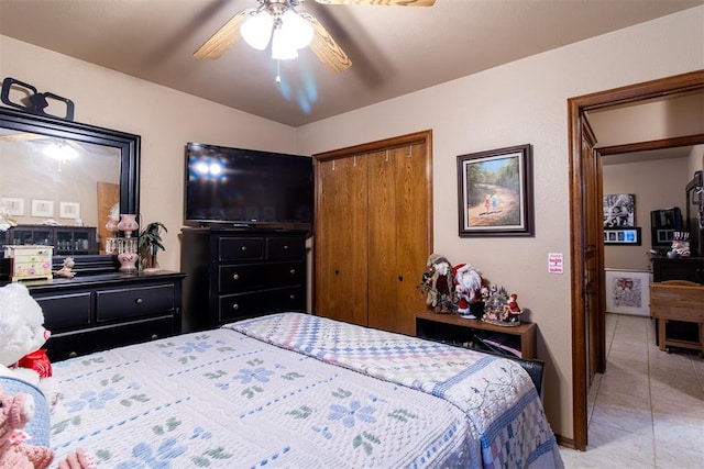 bedroom with ceiling fan and light tile patterned flooring