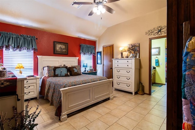 bedroom featuring multiple windows, ceiling fan, light tile patterned floors, and vaulted ceiling