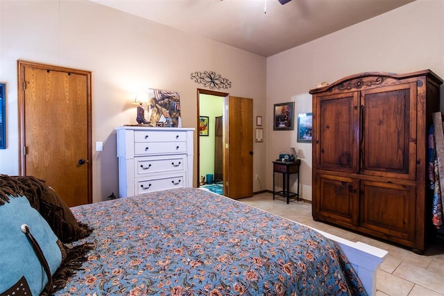 tiled bedroom featuring ceiling fan