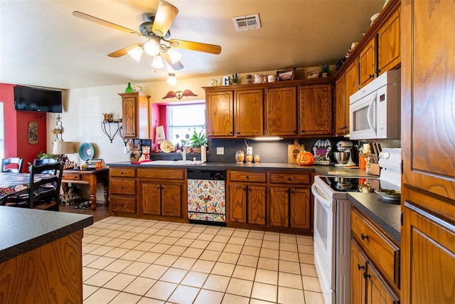 kitchen with white appliances, sink, ceiling fan, tasteful backsplash, and light tile patterned flooring