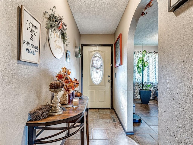 entrance foyer featuring a textured ceiling