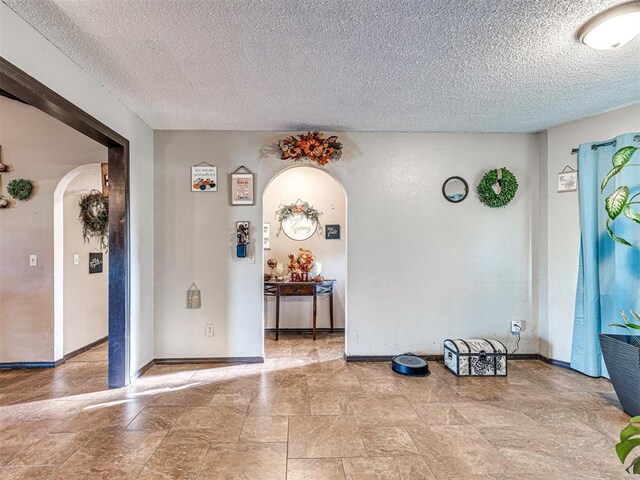 interior space featuring a textured ceiling