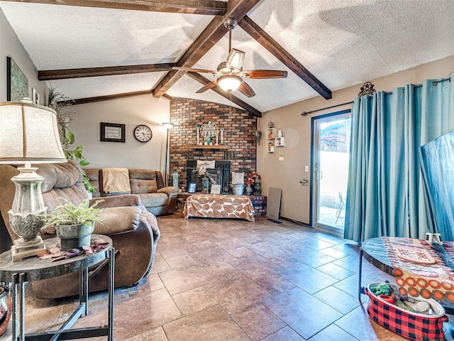 living room with a textured ceiling, lofted ceiling with beams, and ceiling fan