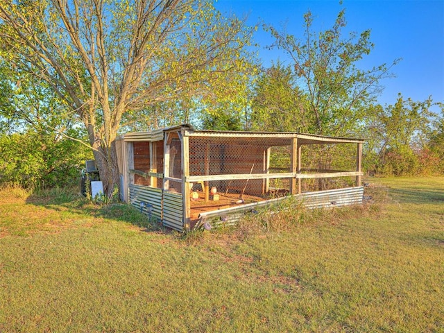 view of outdoor structure featuring a yard