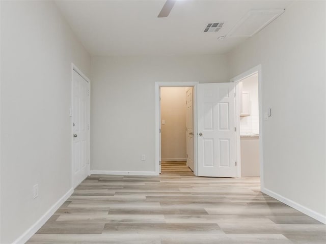 unfurnished bedroom featuring ceiling fan and light hardwood / wood-style flooring