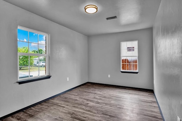 spare room with light hardwood / wood-style floors