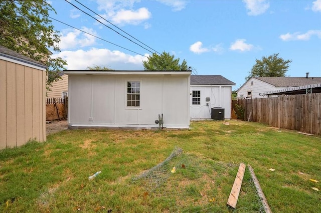 rear view of property with a lawn