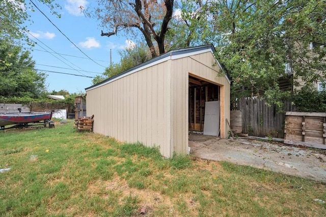 view of outbuilding featuring a lawn