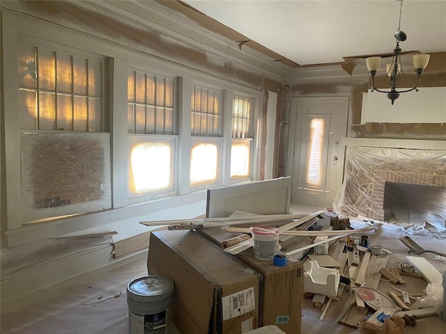 misc room featuring a chandelier and ornamental molding