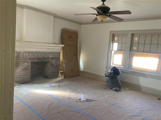 unfurnished living room featuring ceiling fan, a fireplace, and ornamental molding